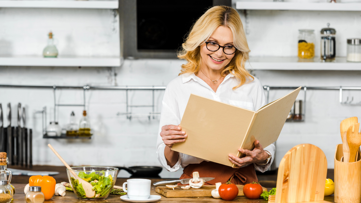 Woman looking at cookbook