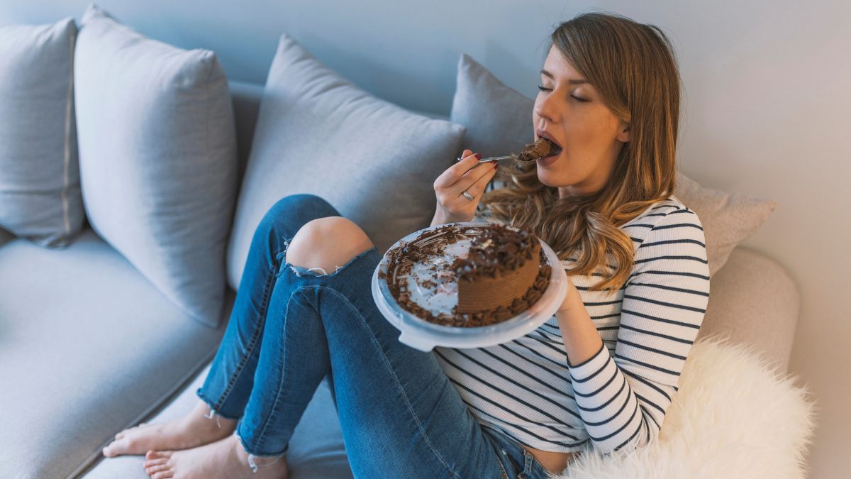 woman eating chocolate cake