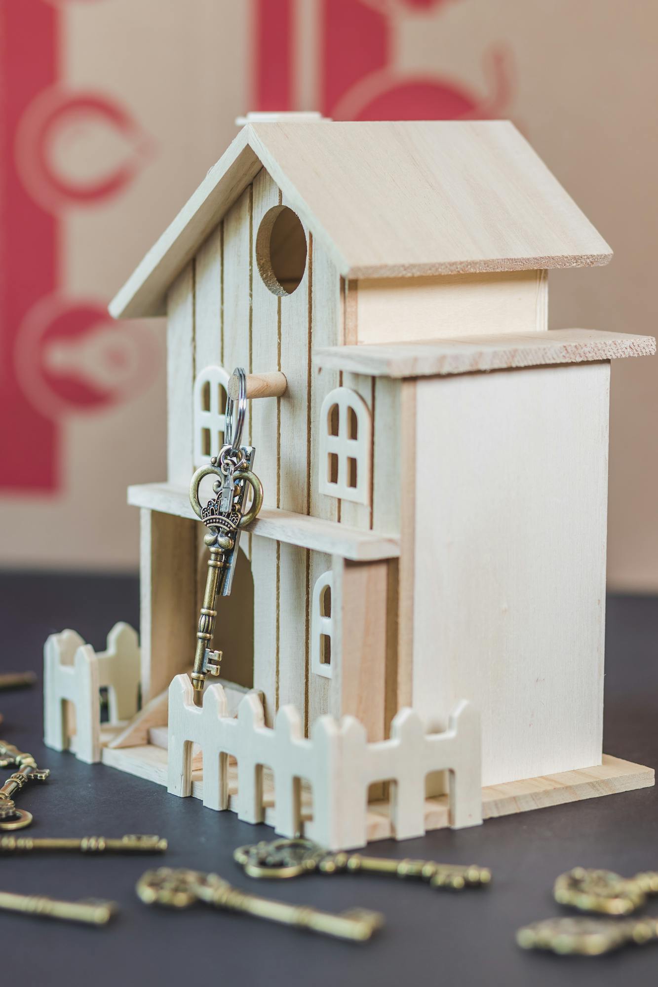 Detailed wooden miniature house with vintage keys, perfect for DIY enthusiasts.